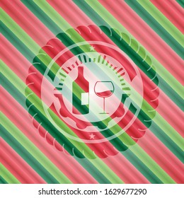 bottle and glass of wine icon inside christmas badge background.