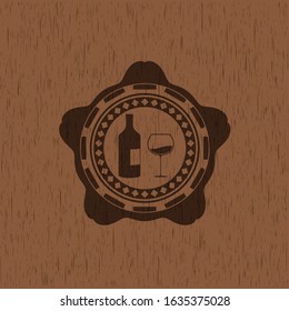 bottle and glass of wine icon inside wooden emblem. Vintage.