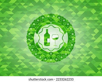 bottle and glass of wine icon inside green emblem. Mosaic background. 