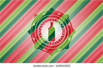 bottle icon inside christmas colors badge.