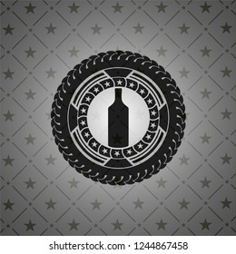 bottle icon inside dark badge or emblem
