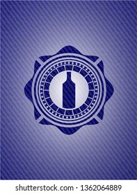 bottle icon inside emblem with jean high quality background