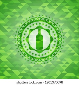 bottle icon inside green emblem with mosaic background