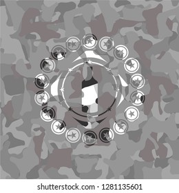 bottle icon inside grey camo emblem