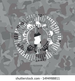 bottle icon inside grey camouflage emblem