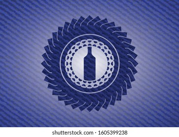 bottle icon inside jean or denim emblem or badge background
