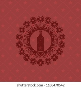 bottle icon inside red emblem