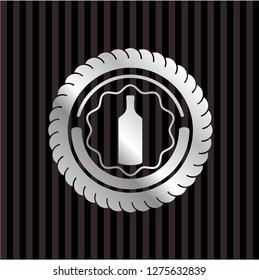 bottle icon inside silver emblem or badge