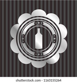bottle icon inside silvery emblem