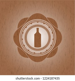 bottle icon inside wooden emblem. Retro