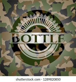 Bottle on camouflage texture