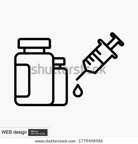 Bottle with a solution for injection and a syringe.