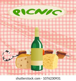 a bottle of wine, cheese, fried meat on a tablecloth background for a picnic