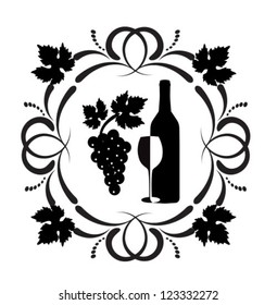 A bottle of wine, a glass and a bunch of grapes surrounded by ornaments of scrolls and grape leaves.