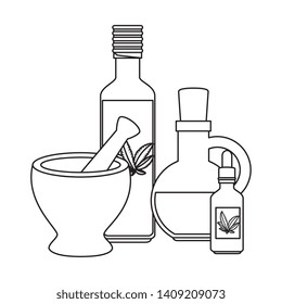 bottles with cannabis extract products and grinder