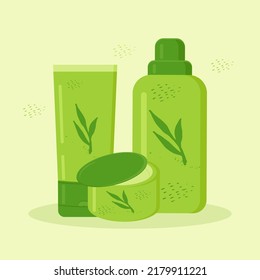 bottles and tubes and jar with cosmetics is decorated with plants in green