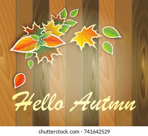 Bouquet of bright autumn leaves on a wooden background