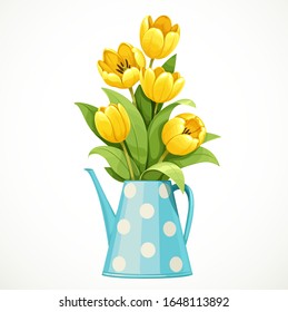 Bouquet of yellow tulips in a tall blue polka-dot jug with a thin nose isolated on white background