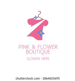 Boutique logo design concept. Icon of pink clothes and flower decoration. Used for clothes shop. Flat design style