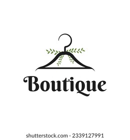 Boutique logo design creative idea with hanger icon and leaf