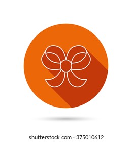 Bow icon. Gift bow-knot sign. Round orange web button with shadow.