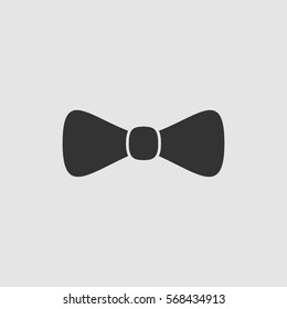 Bow tie icon flat. Black pictogram on grey background. Vector illustration symbol