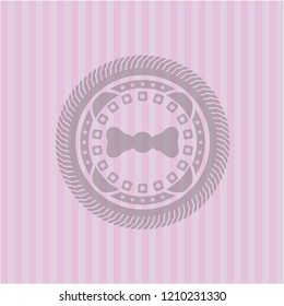 bow tie icon inside badge with pink background