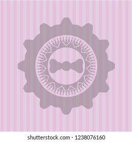 bow tie icon inside badge with pink background