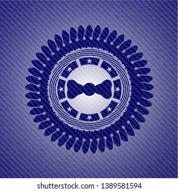 bow tie icon inside badge with denim texture