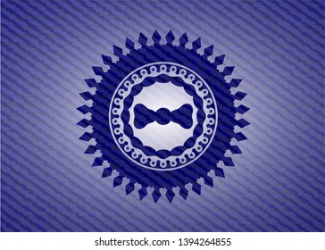 bow tie icon inside badge with jean texture