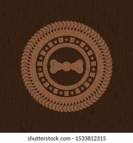 bow tie icon inside badge with wooden background