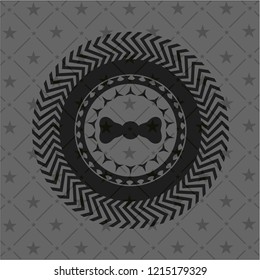 bow tie icon inside black emblem