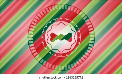 bow tie icon inside christmas badge.