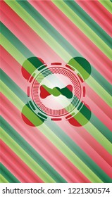 bow tie icon inside christmas colors style emblem.
