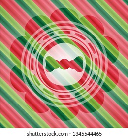 bow tie icon inside christmas colors style emblem.