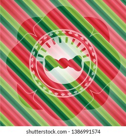 bow tie icon inside christmas colors emblem.
