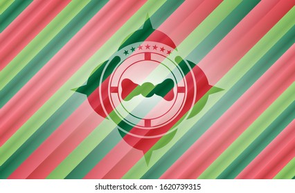 bow tie icon inside christmas colors emblem.