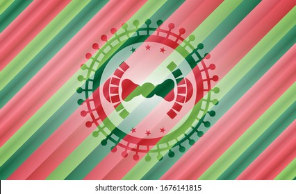 bow tie icon inside christmas colors style emblem.