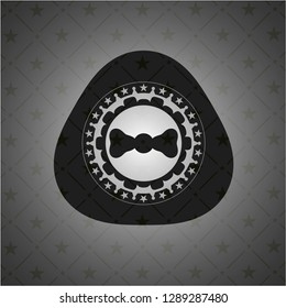 bow tie icon inside dark emblem