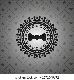 bow tie icon inside dark emblem. Retro