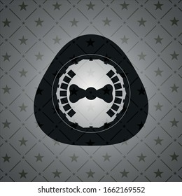 bow tie icon inside dark emblem