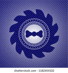 bow tie icon inside denim background