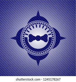 bow tie icon inside denim background