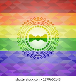 bow tie icon inside emblem on mosaic background with the colors of the LGBT flag