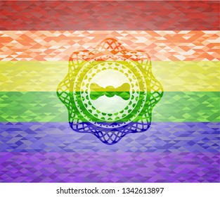 bow tie icon inside emblem on mosaic background with the colors of the LGBT flag