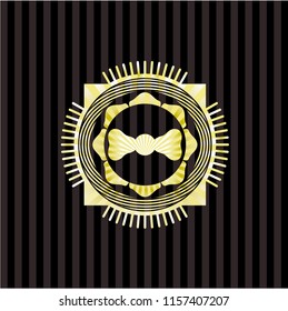 bow tie icon inside gold badge or emblem