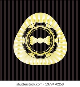 bow tie icon inside golden emblem