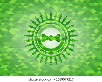 bow tie icon inside green mosaic emblem
