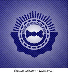 bow tie icon inside jean or denim emblem or badge background