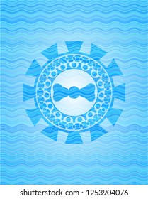 bow tie icon inside light blue water style emblem.